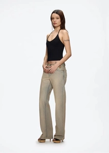 Full view of black halter top paired with light blue low-waist wide-leg denim jeans