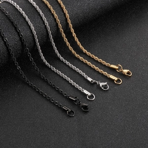 Detailed close-up of hip hop twisted rope chains in gold, silver and black finishes