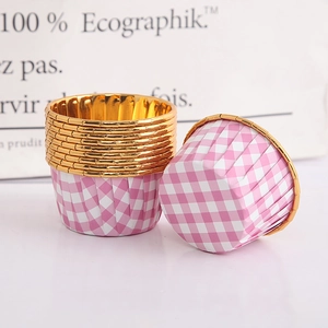 Detail of pink plaid paper cupcake liners with premium gold rolled edges for baking