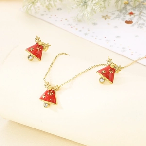 Christmas jewelry set with red enamel bells and golden reindeer antlers on a necklace