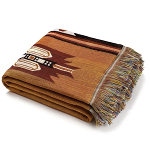 Detailed macro view of bohemian woven blanket with thick texture and colorful tassels
