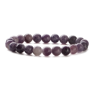 Natural purple stone bead bracelet with smooth round beads on a clean white background