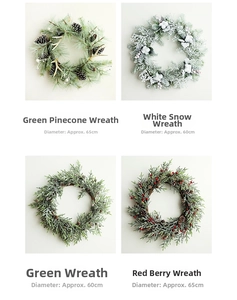 Detail view of four festive Christmas wreaths with pinecones, snow, and red berries
