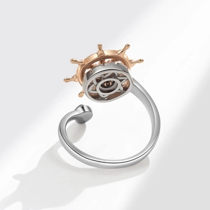 Adjustable two-tone spinning nautical ship wheel ring in silver and rose gold finish