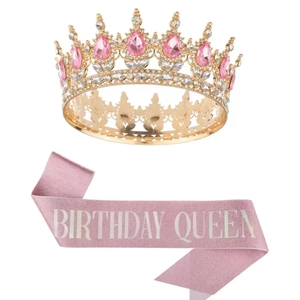 Detail of a luxury gold crown with pink rhinestones and a Birthday Queen glitter sash