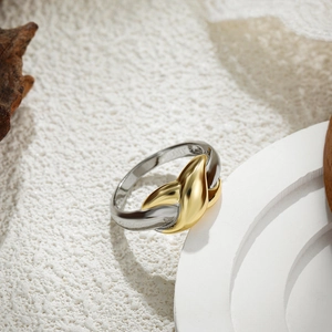 Close-up of S925 hallmark on two-tone gold and silver interlocking layered ring