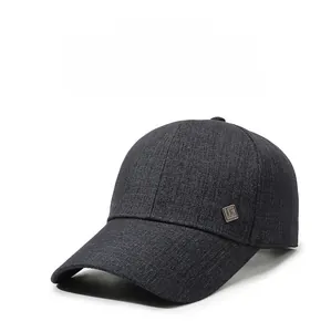Detail view of dark grey baseball cap showing textured fabric and square metal logo