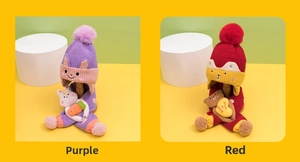 Detailed close-up of cute purple rabbit and red bear knitted winter hat and scarf sets