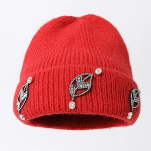 Winter knitted beanie in vibrant red with elegant rhinestone leaf appliques and thick warm fabric