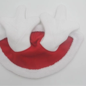 Detail of red plush Christmas horse cape with white faux fur trim and reindeer antlers