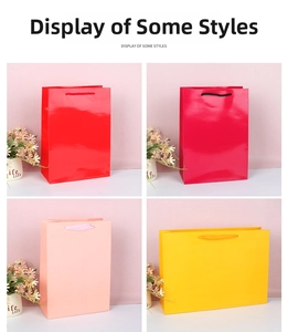 Close-up of glossy paper gift bags in red, magenta, pink, and yellow colors