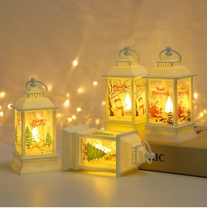 Detail of white Christmas lanterns with warm LED lights and festive holiday illustrations