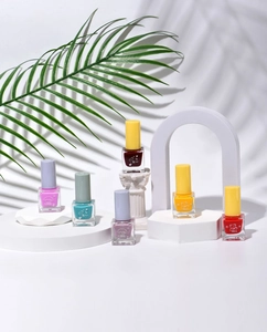 Five bottles of peelable water-based nail polish in purple, red, cyan, and yellow colors