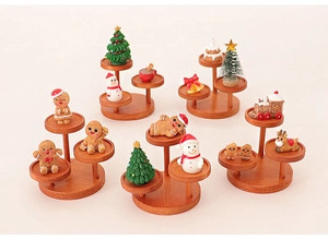 Miniature Christmas set with gingerbread man, snowman and trees on wooden stands