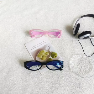 Retro cat eye sunglasses in pink and black with premium plastic frame in creative layout