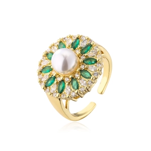 Detail of 18K gold plated ring featuring white pearl and green marquise zircons