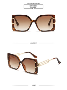 Detail of leopard print frames with golden hollow metal temples and brown gradient lenses