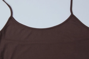 Detail showing the ribbed cotton fabric and U-neckline of a brown summer camisole top