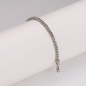 Minimalist silver stainless steel woven chain bracelet in a hip-hop aesthetic style