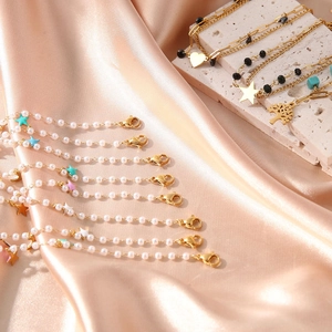 Luxurious pearl and gold-plated bracelets featuring star, heart, and tree pendants