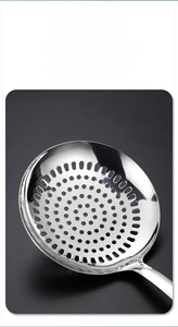 Close-up of a 304 stainless steel slotted spoon with precision-cut drainage holes
