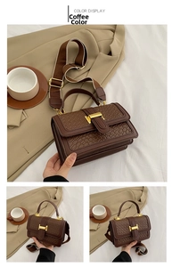 Detailed view of the brown lattice pattern texture and gold H metal buckle on the handbag