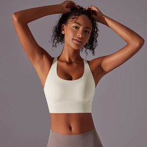 Vista frontale del reggiseno sportivo avorio con spalline larghe e fascia elastica