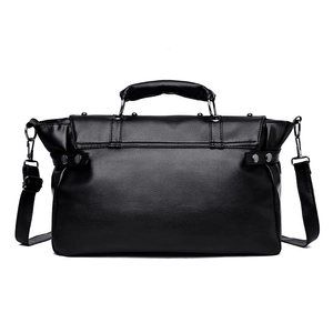 Retro punk style black leather crossbody bag with silver skull rivets and adjustable strap