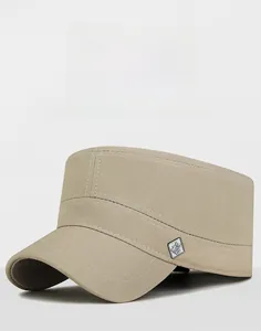 Close-up of beige cotton canvas cadet hat with silver square metal emblem detail