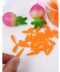 Close-up of 1.8cm miniature resin carrots and radishes for DIY dollhouse scenes