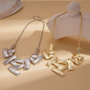 Artistic geometric square necklace with brushed metal texture in gold and silver
