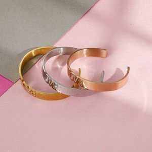 Minimalist LOVE letter open bangle in gold, silver, and rose gold with zircon accents