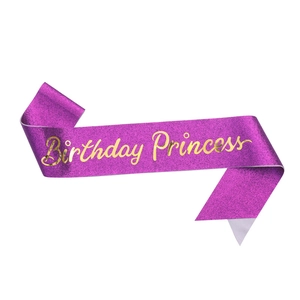 Sparkly purple Birthday Princess sash with golden cursive text for party celebrations