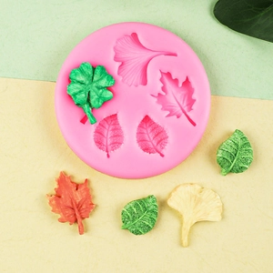 Silicone mold featuring maple and ginkgo leaf patterns for baking and DIY fondant decoration