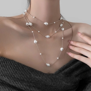 Elegant layered pearl necklace with baroque pearls on a silver chain for women