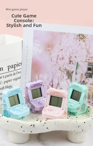 Close-up of four colorful mini arcade game consoles with cute cartoon animal patterns