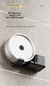 Heavy-duty wall-mounted hair dryer holder showing strong load-bearing capacity on marble wall