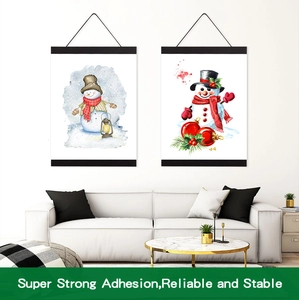 Detail showing magnetic wooden poster hangers with strong adhesion for snowman wall art