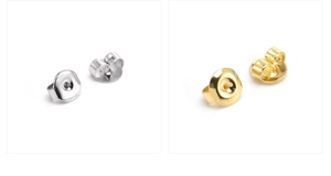 Close-up of butterfly earring backs in gold and silver finish with detailed structure