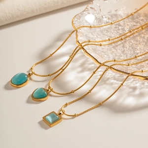 Elegant gold necklaces set with blue opal pendants in oval, heart, and square shapes