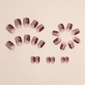 Short square press-on nails with wine red gradient and silver glitter accents