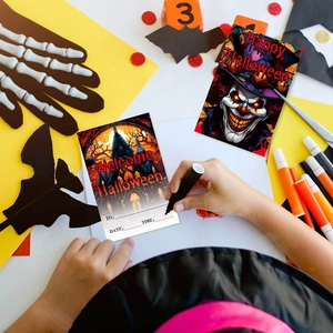Halloween party invitation cards with spooky clown and castle designs for guest writing