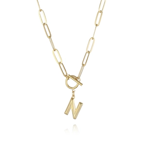 Macro view of gold plated paperclip chain with 3D letter N pendant and OT toggle buckle