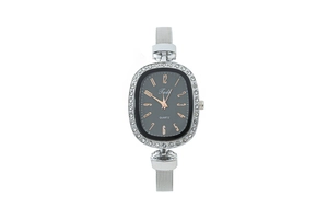 Detail view of oval silver watch featuring crystal bezel and black dial with rose gold numbers
