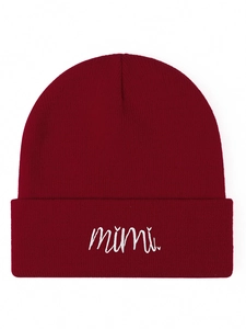Detailed close-up of dark red knitted beanie with white Mimi letter embroidery texture
