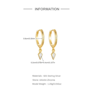 Detail view of 925 sterling silver gold hoop earrings with kite-shaped zirconia charms