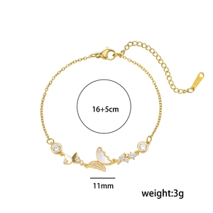 Elegant gold-plated butterfly bracelet with zircon and shell elements on white background