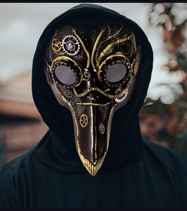 Steampunk plague doctor mask detail showing black leather texture and gold gear accents