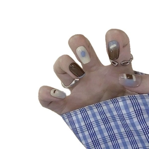 Hand-painted press-on nails with chocolate and blue gradient patterns on square nail tips