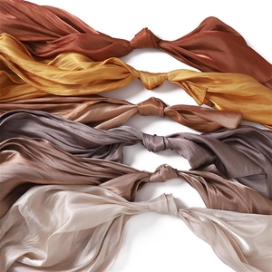 Macro detail of silk texture and glossy satin fabric in various earthy color tones